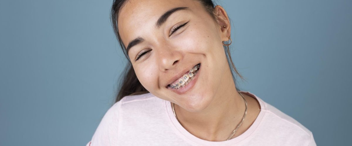 portrait-smiley-teenage-girl-with-braces